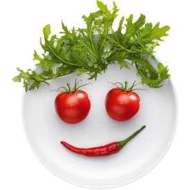 Teller mit lächelndem Gesicht aus Gemüse